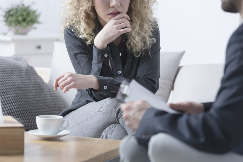 Female patient with nervous breakdown during therapy session