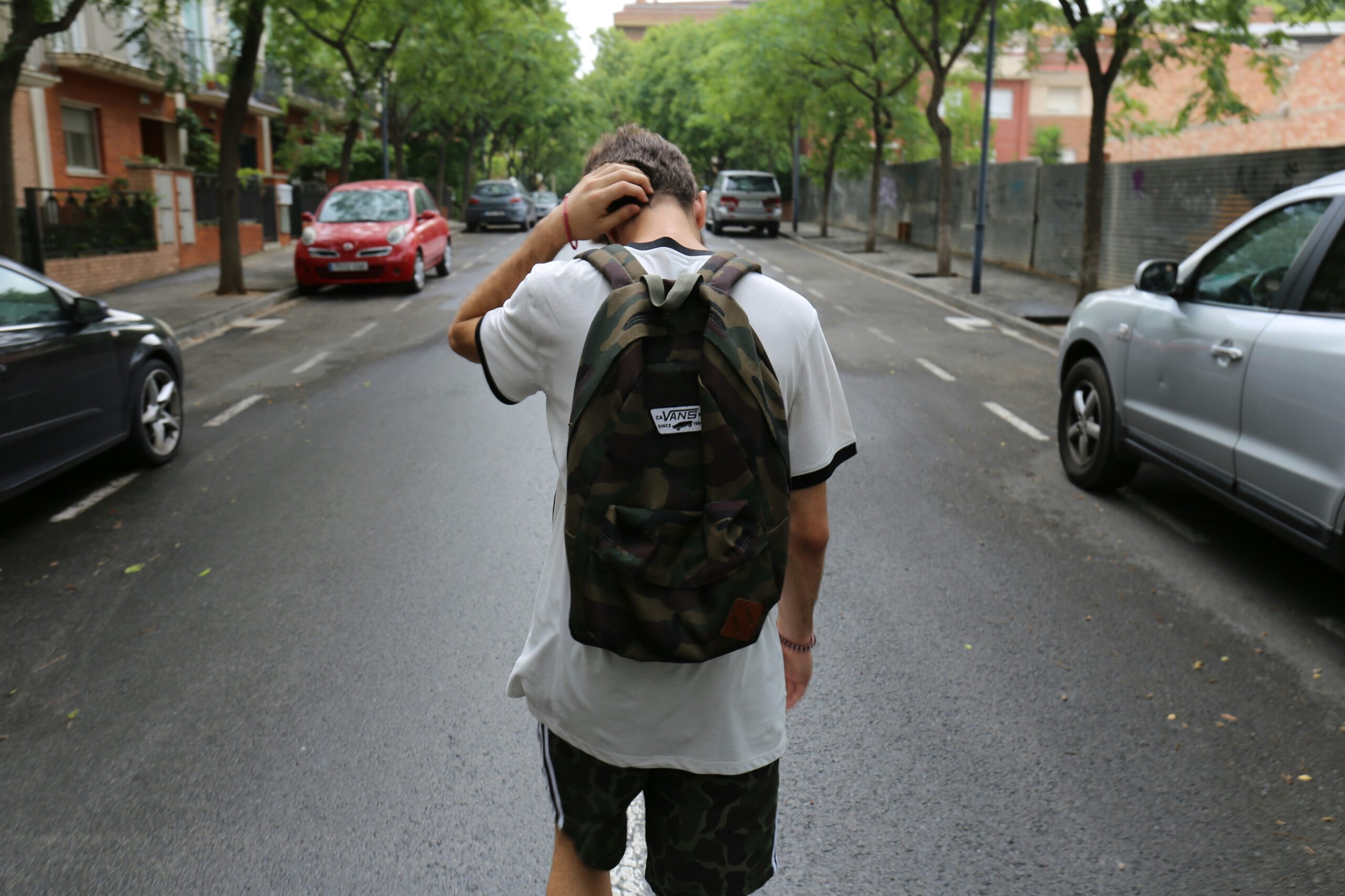 teen walking down street