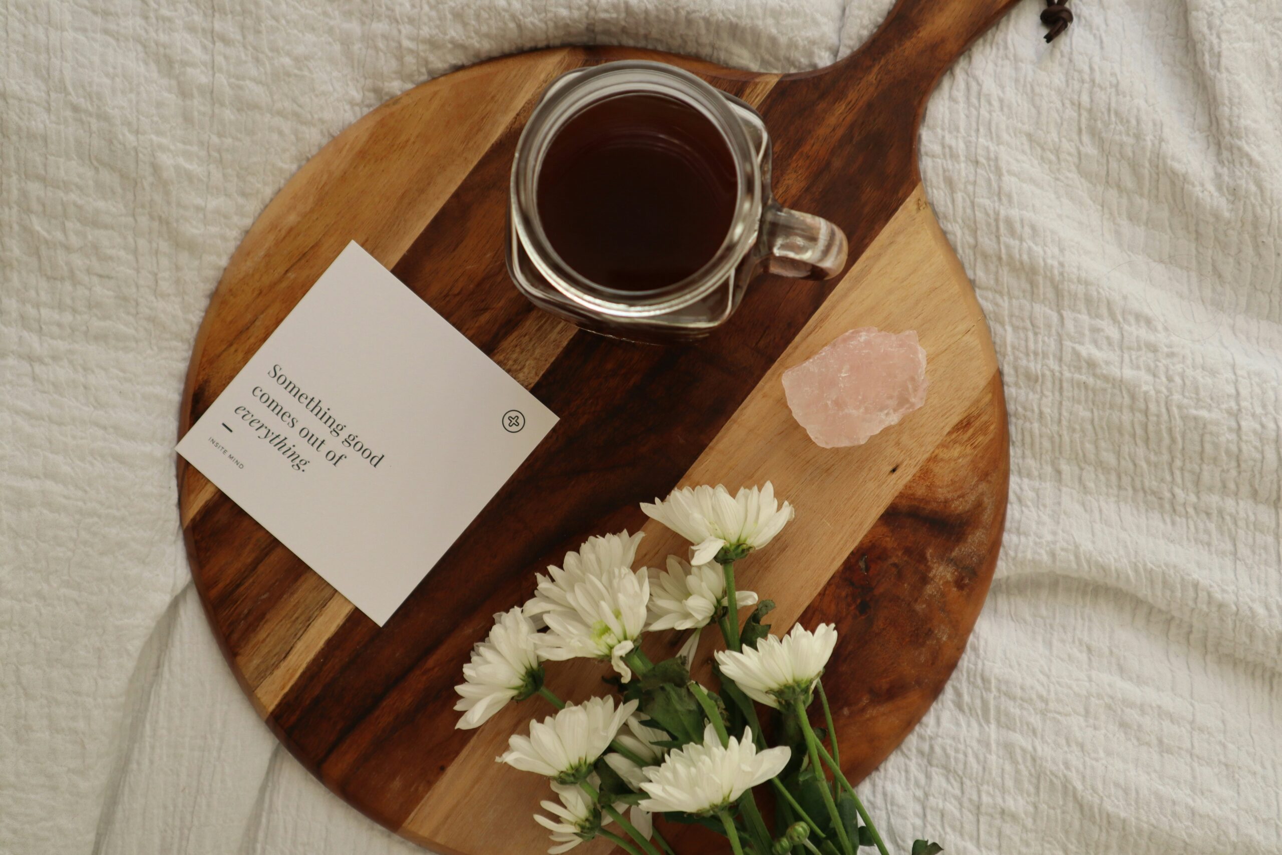 Cheese board with flowers and Rose crystal and an affirmation card.
